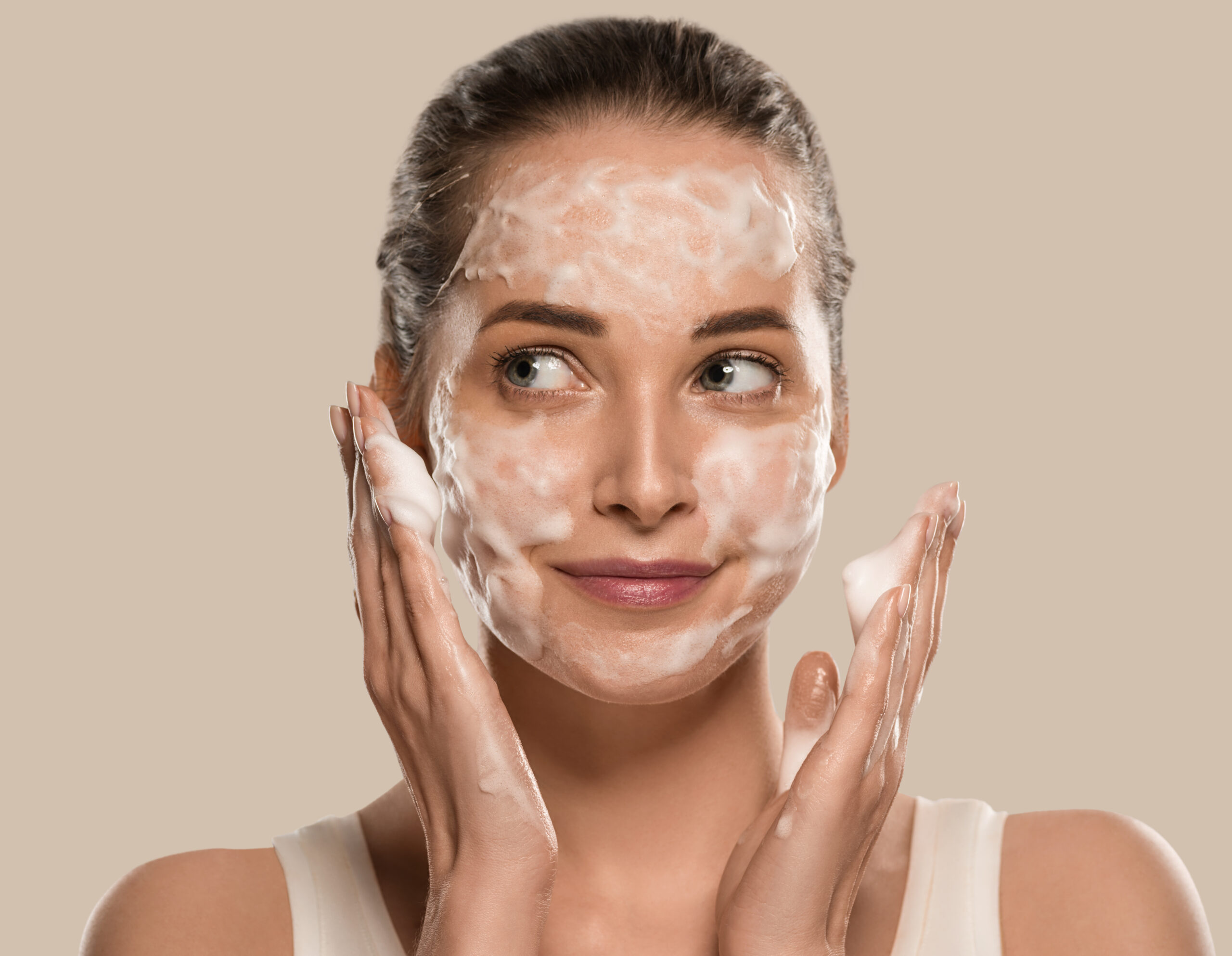 Soap face woman clean skin beauty. Color background. Brown