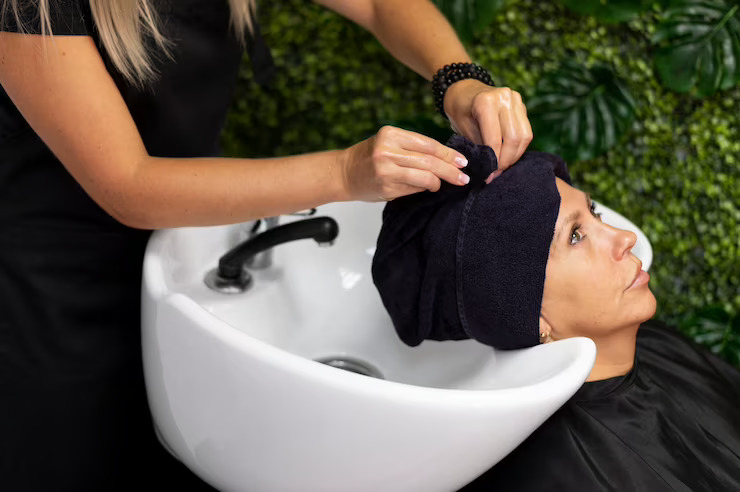 woman-getting-her-hair-done-beauty-salon_23-2149167391